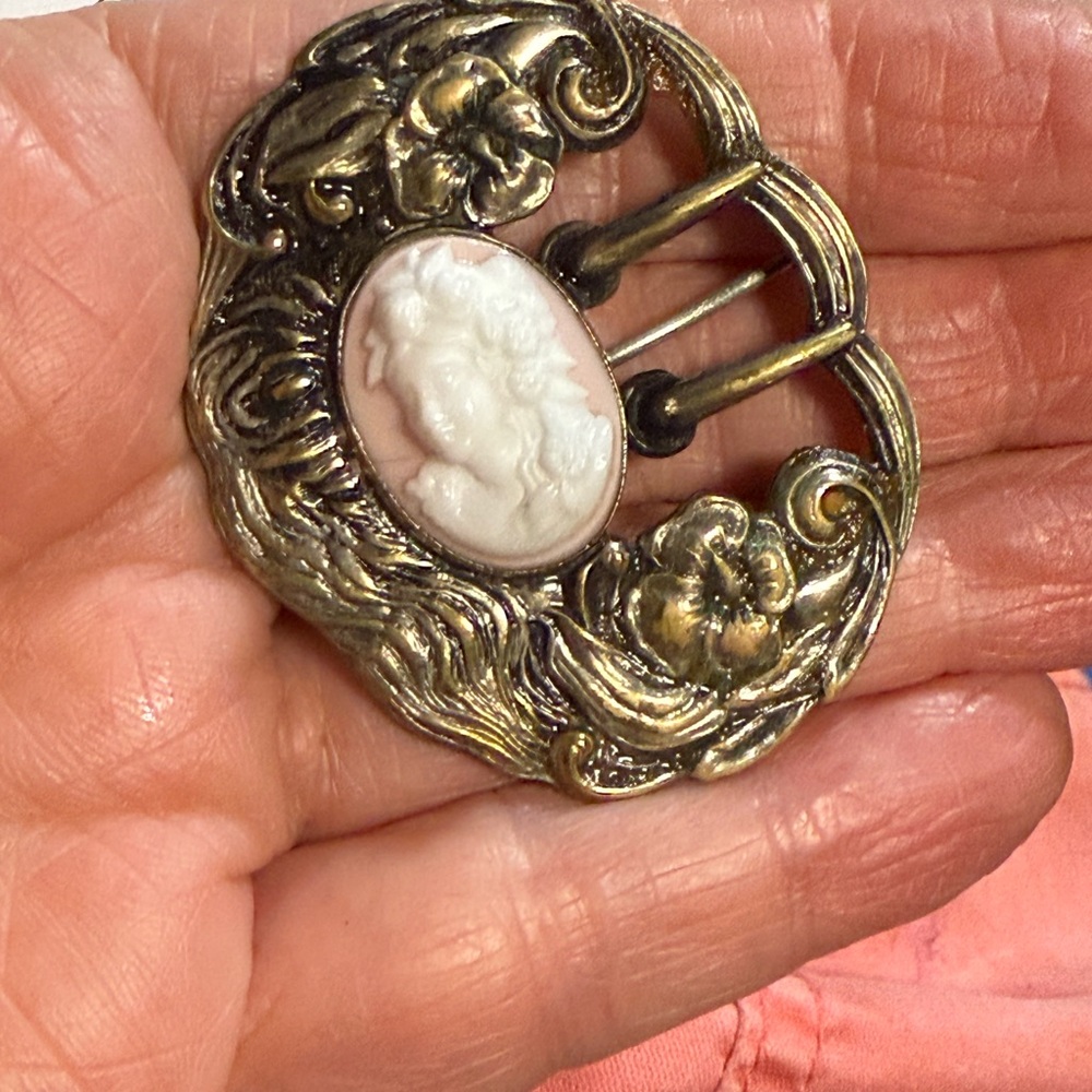 38.)Vintage Gold tone and White Cameo Brooch, C clamp . Extremely old see photos